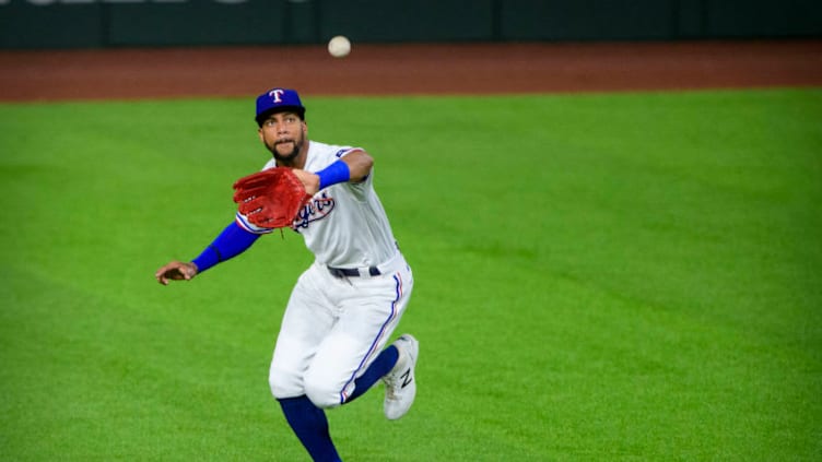 Sep 24, 2020; Arlington, Texas, USA; Texas Rangers center fielder Leody Taveras (65) makes a fielding error during the first inning against the Houston Astros at Globe Life Field. Mandatory Credit: Jerome Miron-USA TODAY Sports