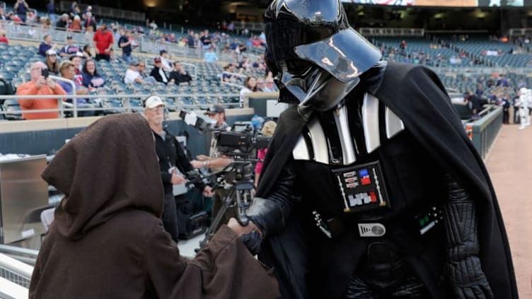 MINNEAPOLIS, MN - MAY 4: Darth Vader shakes hands with a fan dressed as Anakin Skywalker before the game between the Minnesota Twins and the Oakland Athletics as part of May the 4th Be With You night on May 4, 2015 at Target Field in Minneapolis, Minnesota. (Photo by Hannah Foslien/Getty Images)