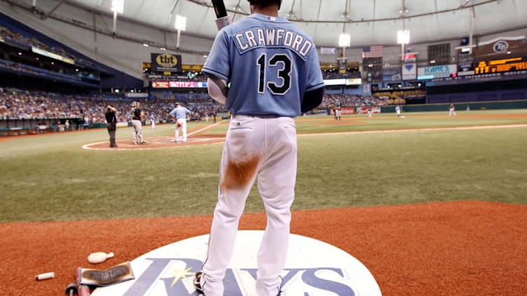 ST. PETERSBURG - JUNE 13: Outfielder Carl Crawford #13 of the Tampa Bay Rays looks on from the on deck circle against the Florida Marlins during the game at Tropicana Field on June 13, 2010 in St. Petersburg, Florida. (Photo by J. Meric/Getty Images)