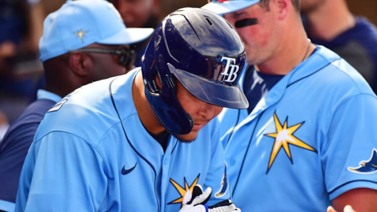 PORT CHARLOTTE, FLORIDA - FEBRUARY 24: Yoshitomo Tsutsugo #25 of the Tampa Bay Rays bows in the dugout after hitting his first home run for the Tampa Bay Rays(Photo by Julio Aguilar/Getty Images)