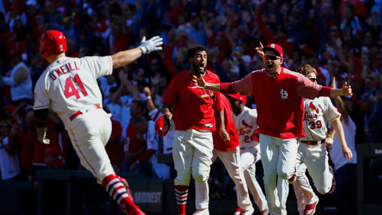 ST. LOUIS, MO - SEPTEMBER 22: Austin Gomber #68 and Jose Martinez #38 of the St. Louis Cardinals rush the field to celebrate after Tyler O'Neill #41 of the St. Louis Cardinals hit a walk-off home run against the San Francisco Giants in the tenth inning at Busch Stadium on September 22, 2018 in St. Louis, Missouri. (Photo by Dilip Vishwanat/Getty Images)