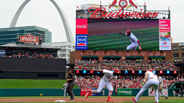 ST LOUIS, MO - APRIL 19: Dexter Fowler #25 of the St. Louis Cardinals is congratulated by third base coach Chris Maloney #77 after hitting a solo home run against the Pittsburgh Pirates during the third inning at Busch Stadium on April 19, 2017 in St Louis, Missouri. (Photo by Jeff Curry/Getty Images)