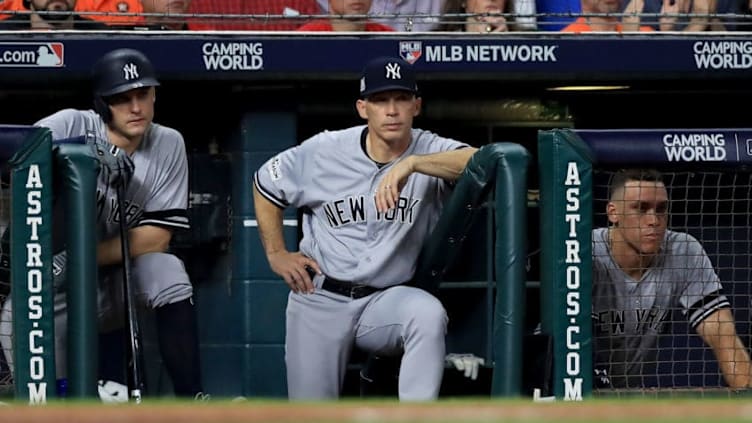 HOUSTON, TX - OCTOBER 21: Greg Bird #33, manager Joe Girardi #28 and Aaron Judge #99 of the New York Yankees look on from the dugout during the sixth inning against the Houston Astros in Game Seven of the American League Championship Series at Minute Maid Park on October 21, 2017 in Houston, Texas. (Photo by Ronald Martinez/Getty Images)