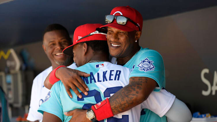 LOS ANGELES, CALIFORNIA - JULY 16: First Base Coach Eric Davis hugs Jordan Walker #22 of the National League before the SiriusXM All-Star Futures Game at Dodger Stadium on July 16, 2022 in Los Angeles, California. (Photo by Kevork Djansezian/Getty Images)