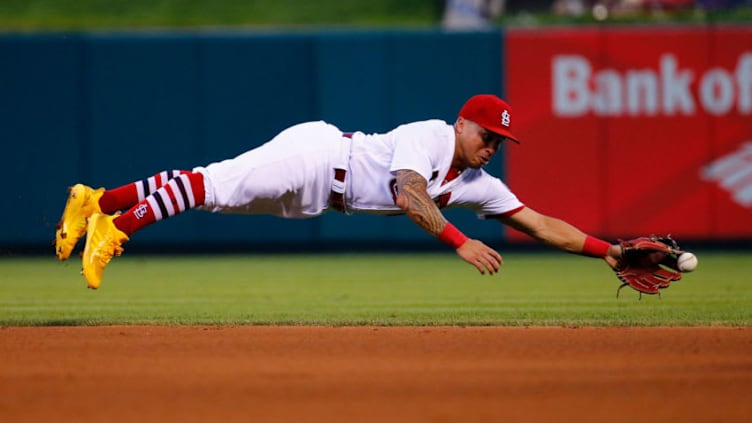 ST. LOUIS, MO - JULY 13: Kolten Wong #16 of the St. Louis Cardinals attempts to catch a line drive against the Cincinnati Reds in the third inning at Busch Stadium on July 13, 2018 in St. Louis, Missouri. (Photo by Dilip Vishwanat/Getty Images)