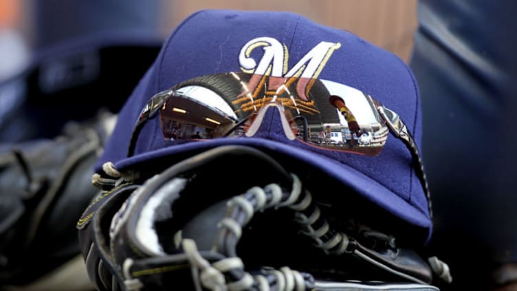 MILWAUKEE, WI - MAY 23: Norichika Aoki's of the Milwaukee Brewers sunglasses, cap and glove sit on the steps on the Brewers dugout during during the sausage races in the game against the San Francisco Giants at Miller Park on May 23, 2012 in Milwaukee, Wisconsin. (Photo by Mike McGinnis/Getty Images)