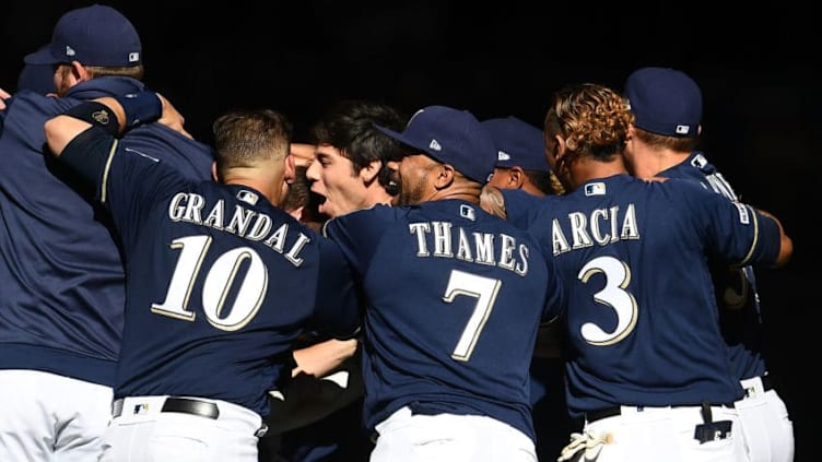 MILWAUKEE, WISCONSIN - MARCH 31: Christian Yelich #22 of the Milwaukee Brewers celebrates with teammates after hitting the game winning double against the St. Louis Cardinals at Miller Park on March 31, 2019 in Milwaukee, Wisconsin. (Photo by Stacy Revere/Getty Images)