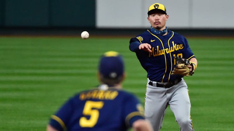 Sep 26, 2020; St. Louis, Missouri, USA; Milwaukee Brewers second baseman Keston Hiura (18) throws to first baseman Jedd Gyorko (5) during the fifth inning against the St. Louis Cardinals at Busch Stadium. Mandatory Credit: Jeff Curry-USA TODAY Sports