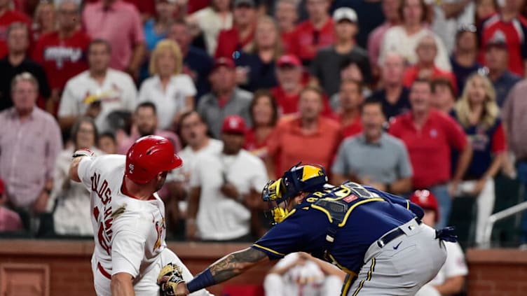 Sep 28, 2021; St. Louis, Missouri, USA; Milwaukee Brewers catcher Omar Narvaez (10) tags out St. Louis Cardinals first baseman Paul Goldschmidt (46) during the third inning at Busch Stadium. Mandatory Credit: Jeff Curry-USA TODAY Sports