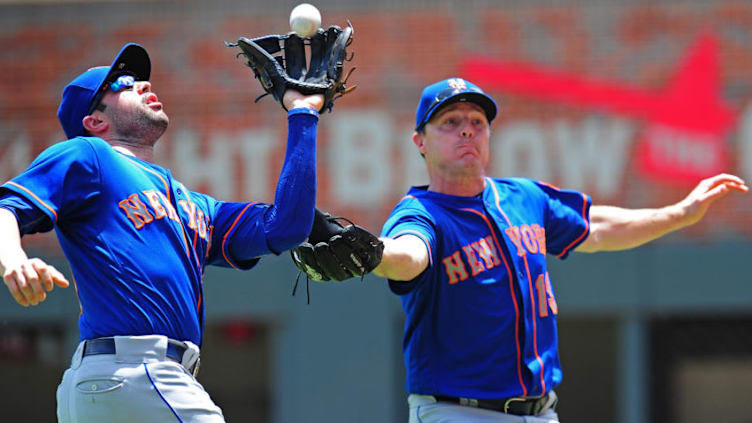 ATLANTA, GA - JUNE 11: Wilmer Flores #4 of the New York Mets catches a popup in front of Jay Bruce #19 during the second inning against the Atlanta Braves at SunTrust Park on June 11, 2017 in Atlanta, Georgia. (Photo by Scott Cunningham/Getty Images)