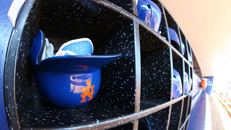 PORT ST. LUCIE, FL - MARCH 06: Helmets in the New York Mets dugout before of a spring training game against the Houston Astros at First Data Field on March 6, 2018 in Port St. Lucie, Florida. (Photo by Rich Schultz/Getty Images)