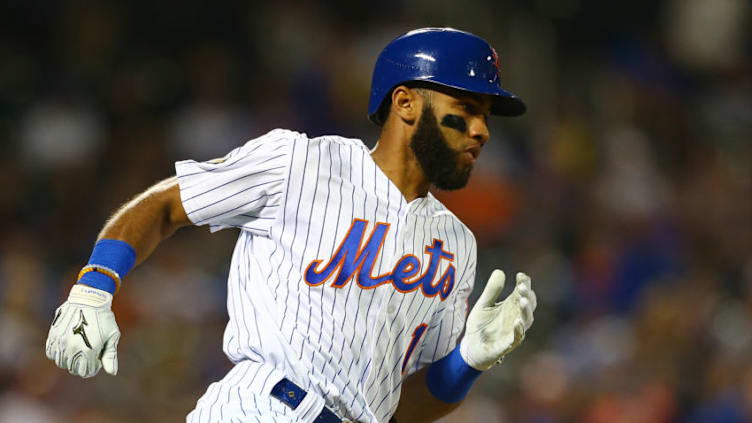 NEW YORK, NY - MAY 05: Amed Rosario #1 of the New York Mets runs to first base after hitting a single to left in the fifth inning against the Colorado Rockies at Citi Field on May 5, 2018 in the Flushing neighborhood of the Queens borough of New York City. (Photo by Mike Stobe/Getty Images)