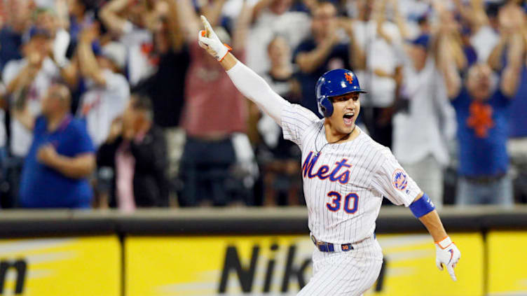 NEW YORK, NY - AUGUST 09: Michael Conforto #30 of the New York Mets running as he celebrates after hitting a walk off rbi single to win the game in the bottom of the ninth inning in an MLB baseball game against the Washington Nationals on August 9, 2019 at Citi Field in the Queens borough of New York City. Mets won 7-6. (Photo by Paul Bereswill/Getty Images)