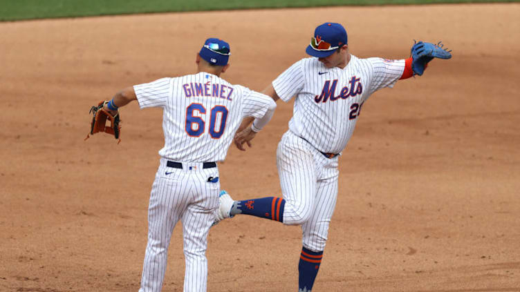 NEW YORK, NEW YORK - JULY 24: Pete Alonso #20 and Andres Gimenez #60 of the New York Mets celebrate a 1-0 win against the Atlanta Bravesduring Opening Day at Citi Field on July 24, 2020 in New York City. The 2020 season had been postponed since March due to the COVID-19 pandemic. (Photo by Al Bello/Getty Images)