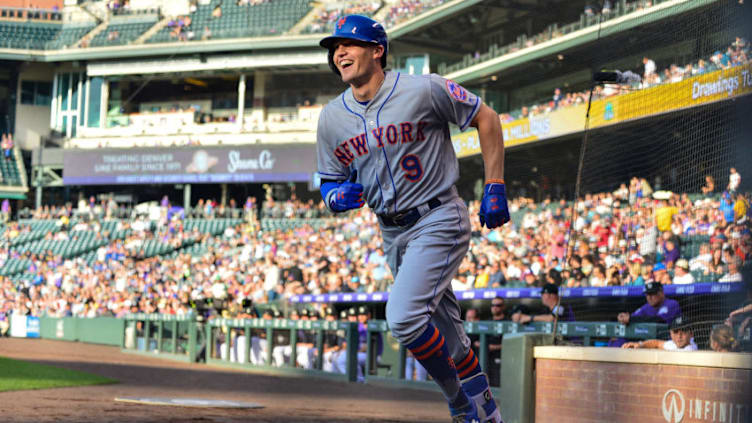 DENVER, CO - JUNE 18: Brandon Nimmo #9 of the New York Mets smiles as he celebrates after scoring on a first inning inside-the-park homerun against the Colorado Rockies at Coors Field on June 18, 2018 in Denver, Colorado. (Photo by Dustin Bradford/Getty Images)