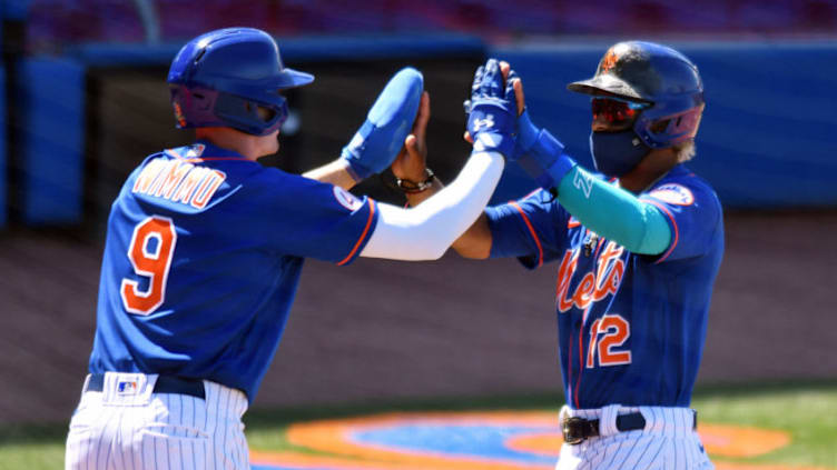 Mar 14, 2021; Port St. Lucie, Florida, USA; New York Mets shortstop Francisco Lindor (12) is congratulated by teammate Brandon Nimmo (9) after both scored in the fifth inning against the St. Louis Cardinals during a spring training game at Clover Park. Mandatory Credit: Jim Rassol-USA TODAY Sports