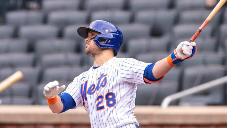 Apr 25, 2021; New York City, New York, USA; New York Mets left fielder J.D. Davis (28) hits a home run during the first inning against the Washington Nationals during the first inning at Citi Field. Mandatory Credit: Vincent Carchietta-USA TODAY Sports