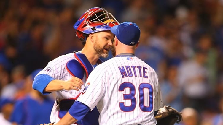 Jun 22, 2015; Chicago, IL, USA; Chicago Cubs catcher David Ross (3) and relief pitcher Jason Motte (30) celebrate after defeating the Los Angeles Dodgers 4-2 at Wrigley Field. Mandatory Credit: Caylor Arnold-USA TODAY Sports