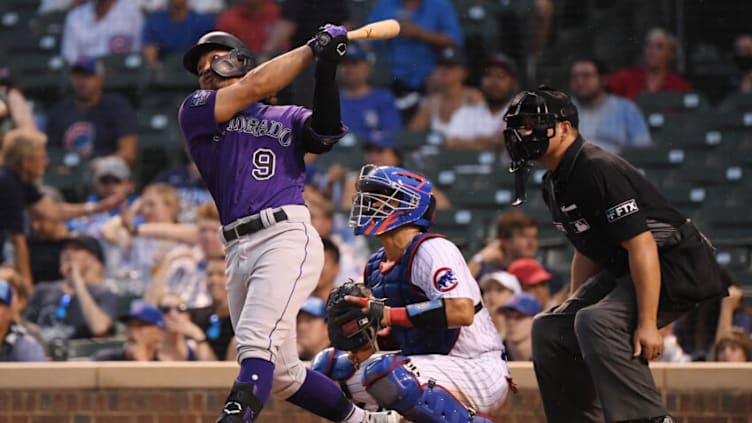 CHICAGO, ILLINOIS - AUGUST 25: Connor Joe #9 of the Colorado Rockies hits a grand slam home run in the fourth inning against the Chicago Cubs at Wrigley Field on August 25, 2021 in Chicago, Illinois. (Photo by Quinn Harris/Getty Images)