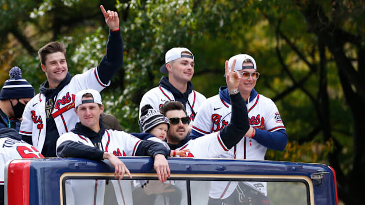 ATLANTA, GEORGIA - NOVEMBER 05: Atlanta Braves players and family members (L-R) Tucker Davidson #64, Kyle Wright #30, Adam Duvall #14 and son Stone, Sean Newcomb #15, Joc Pederson #22 and daughter Poppy celebrate during the World Series Parade on November 05, 2021 in Atlanta, Georgia. (Photo by Michael Zarrilli/Getty Images)