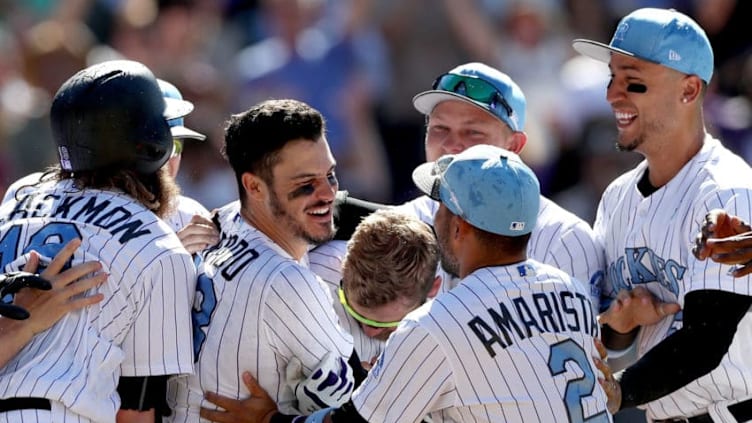 DENVER, CO - JUNE 18: Nolan Arenado #28 of the Colorado Rockies celebrates with his teammates after hitting a 3 RBI walk off home run in the ninth inning against the San Francisco Giants at Coors Field on June 18, 2017 in Denver, Colorado. (Photo by Matthew Stockman/Getty Images)