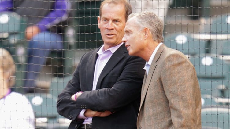 DENVER, CO - APRIL 13: (L-R) Dick Monfort, Owner/Chairman and CEO of the Colorado Rockies and Dan O'Dowd, Executive Vice President and General Manager of the Colorado Rockies watch pregame festivities as the Rockies host the Arizona Diamondbacks at Coors Field on April 13, 2012 in Denver, Colorado. (Photo by Doug Pensinger/Getty Images)