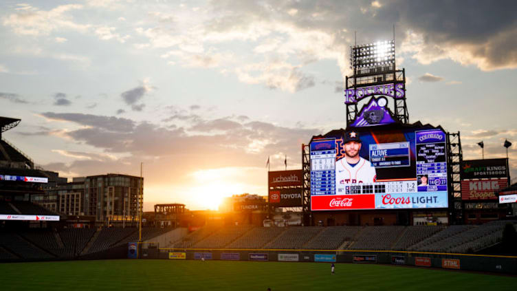 DENVER, CO - AUGUST 19: The sun sets over the stadium as Charlie Blackmon #19 of the Colorado Rockies jogs after a foul ball during the third inning against the Houston Astros at Coors Field on August 19, 2020 in Denver, Colorado. (Photo by Justin Edmonds/Getty Images)