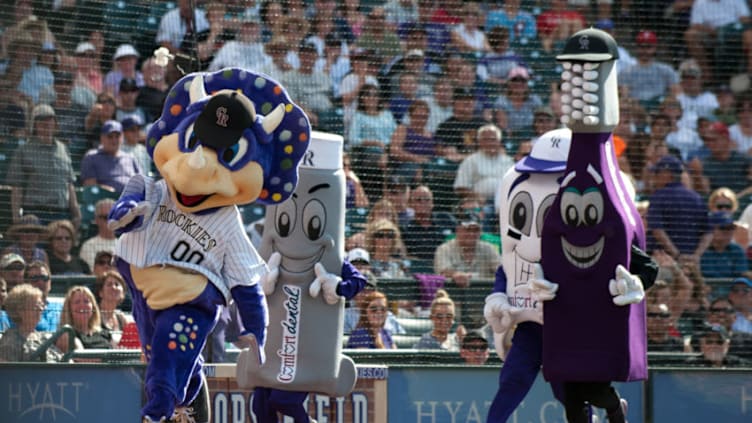 DENVER, CO - JUNE 15: Colorado Rockies mascot Dinger sprints ahead of the Comfort Dental mascot race during a game between the Colorado Rockies and the Philadelphia Phillies at Coors Field on June 15, 2013 in Denver, Colorado. The Rockies beat the Phillies 10-5. (Photo by Dustin Bradford/Getty Images)