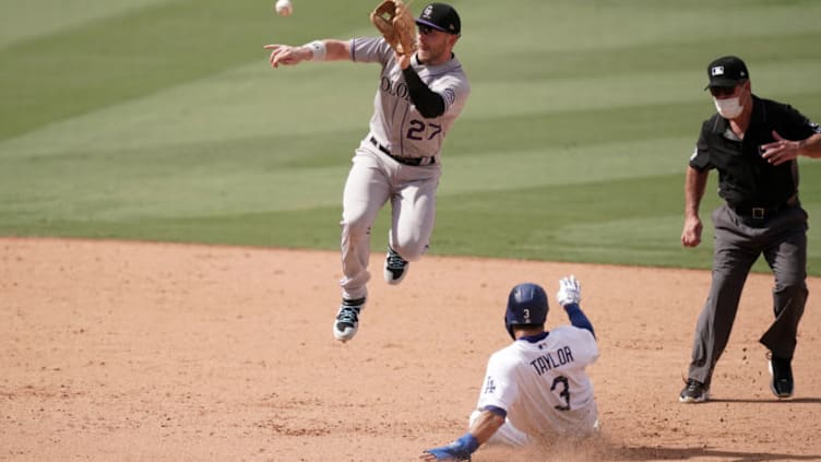 Aug 23, 2020; Los Angeles, California, USA; Los Angeles Dodgers left fielder Chris Taylor (3) slides into second base to beat a throw to Colorado Rockies shortstop Trevor Story (27) for a stolen base in the seventh inning at Dodger Stadium. Mandatory Credit: Kirby Lee-USA TODAY Sports