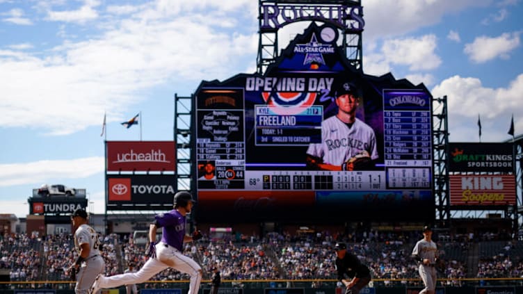 Jun 28, 2021; Denver, Colorado, USA; Colorado Rockies starting pitcher Kyle Freeland (21) outruns the throw to first in the fifth inning against the Pittsburgh Pirates at Coors Field. Mandatory Credit: Isaiah J. Downing-USA TODAY Sports