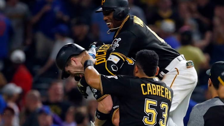 PITTSBURGH, PA - JULY 03: Starling Marte #6 of the Pittsburgh Pirates celebrates with Corey Dickerson #12 of the Pittsburgh Pirates after hitting a game winning sacrifice fly against the Chicago Cubs at PNC Park on July 3, 2019 in Pittsburgh, Pennsylvania. (Photo by Justin K. Aller/Getty Images)