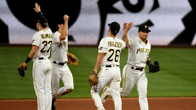 PITTSBURGH, PA - APRIL 27: Phillip Evans #24 of the Pittsburgh Pirates high fives with Adam Frazier #26 after the final out in a 2-1 win over the Kansas City Royals at PNC Park on April 27, 2021 in Pittsburgh, Pennsylvania. (Photo by Justin Berl/Getty Images)