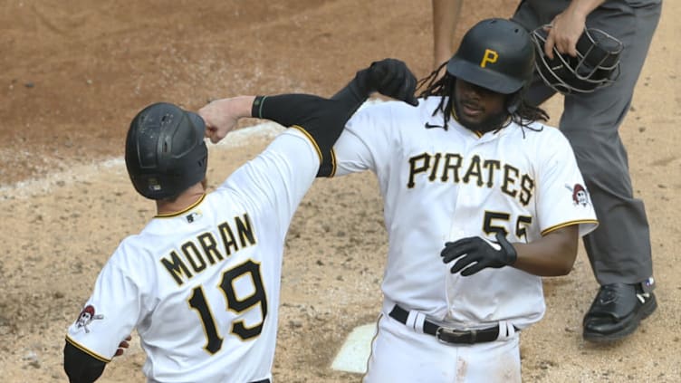 Sep 24, 2020; Pittsburgh, Pennsylvania, USA; Pittsburgh Pirates designated hitter Colin Moran (19) congratulates first baseman Josh Bell (55) on his two run home run against the Chicago Cubs during the fifth inning at PNC Park. Mandatory Credit: Charles LeClaire-USA TODAY Sports