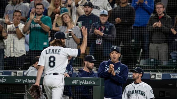 SEATTLE, WA - JULY 3: Starting pitcher Mike Leake #8 of the Seattle Mariners acknowledges fans and teammates including Yusei Kikuchi #18 of the Seattle Mariners (2R) after coming off the fiel during the eighth inning of a game against the St. Louis Cardinals at T-Mobile Park on July 3, 2019 in Seattle, Washington. The Cardinals won the game 5-2. (Photo by Stephen Brashear/Getty Images)