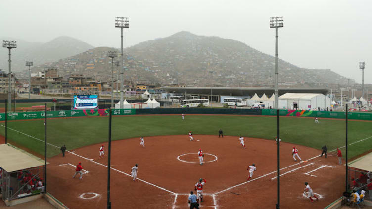 LIMA, PERU - JULY 28: Julio Rodriguez #31 of Mexico hits a single an RBI single in the fourth inning against Cuba in the Men Preliminary Round softball game at Complejo Deportivo Villa Maria del Triunfo on Day 2 of the Lima 2019 Pan American Games on July 28, 2019 in Lima, Peru. (Photo by Patrick Smith/Getty Images)