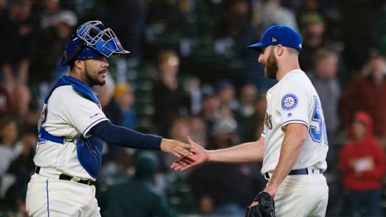 SEATTLE, WA - SEPTEMBER 29: Relief pitcher Anthony Bass of the Seattle Mariners and catcher catcher Omar Narvaez #22 celebrates after a game against the Seattle Mariners at T-Mobile Park on September 29, 2019 in Seattle, Washington. The Mariners won 3-1. (Photo by Stephen Brashear/Getty Images)