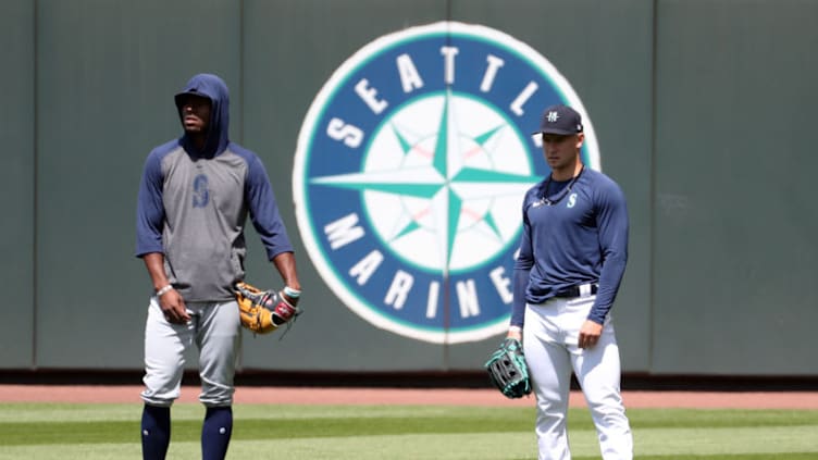 SEATTLE, WASHINGTON - JULY 12: Kyle Lewis #1 (L) and Jarred Kelenic #58 of the Seattle Mariners look on prior to an intrasquad game during summer workouts at T-Mobile Park on July 12, 2020 in Seattle, Washington. (Photo by Abbie Parr/Getty Images)