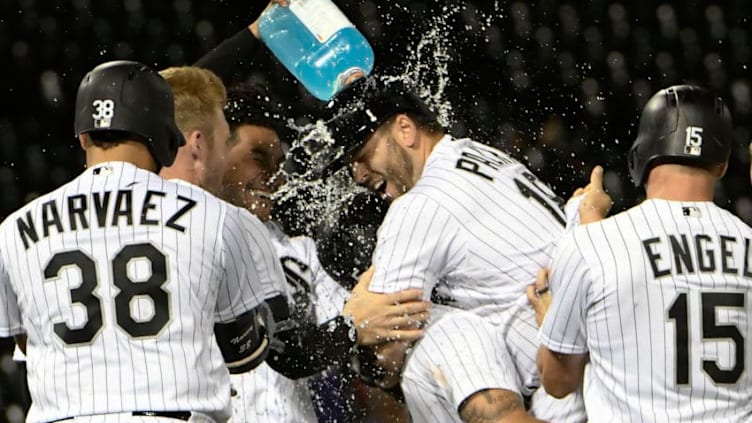 CHICAGO, IL - SEPTEMBER 25: Daniel Palka #18 of the Chicago White Sox is mobbed by his teammates after hitting a two-run game winning single against the Cleveland Indians during the ninth inning on September 25, 2018 at Guaranteed Rate Field in Chicago, Illinois. The White Sox won 5-4.(Photo by David Banks/Getty Images)