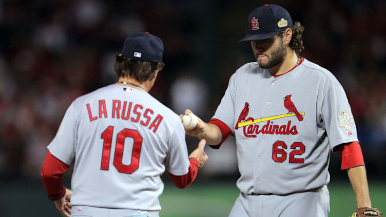 ARLINGTON, TX - OCTOBER 22: Lance Lynn #62 of the St. Louis Cardinals is removed from the game in the seventh inning by manager Tony La Russa during Game Three of the MLB World Series against the Texas Rangers at Rangers Ballpark in Arlington on October 22, 2011 in Arlington, Texas. (Photo by Doug Pensinger/Getty Images)