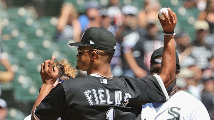 CHICAGO, ILLINOIS - AUGUST 15: Chicago Bears rookie quarterback Justin Fields throws a ceremonial first pitch before the Chicago White Sox take on the New York Yankees at Guaranteed Rate Field on August 15, 2021 in Chicago, Illinois. (Photo by Jonathan Daniel/Getty Images)