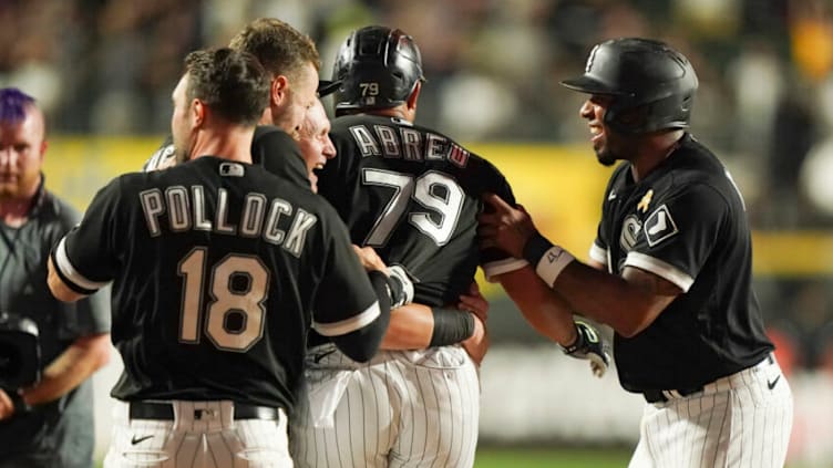 CHICAGO, ILLINOIS - SEPTEMBER 02: Jose Abreu #79 of the Chicago White Sox is congratulated by teammates after his bases loaded fielder's choice during the ninth inning of a game against the Minnesota Twins at Guaranteed Rate Field on September 02, 2022 in Chicago, Illinois. The White Sox defeated the Twins 4-3. (Photo by Nuccio DiNuzzo/Getty Images)