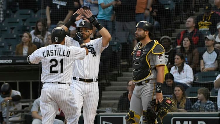 CHICAGO, IL - MAY 08: Welington Castillo #21 of the Chicago White Sox is greeted by Nicky Delmonico #30 after hitting a two-run homer as Francisco Cervelli #29 of the Pittsburgh Pirates stands nearby during the first inning on May 8, 2018 at Guaranteed Rate Field in Chicago, Illinois. (Photo by David Banks/Getty Images)