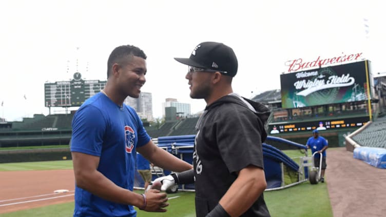 CHICAGO, IL - JULY 24: Jose Quintana (L) of the Chicago Cubs visits with his former teammate Yolmer Sanchez #5 of the Chicago White Sox before the game on July 24, 2017 at Wrigley Field in Chicago, Illinois. (Photo by David Banks/Getty Images)