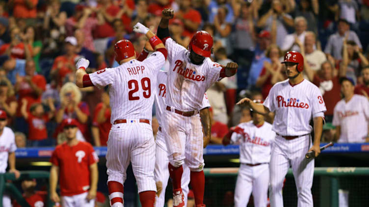 PHILADELPHIA, PA - JULY 22: Cameron Rupp #29 of the Philadelphia Phillies celebrates with Odubel Herrera #37 at home plate after hitting a three-run home run in the eighth inning during a game against the Milwaukee Brewers at Citizens Bank Park on July 22, 2017 in Philadelphia, Pennsylvania. The Brewers won 9-8. (Photo by Hunter Martin/Getty Images)