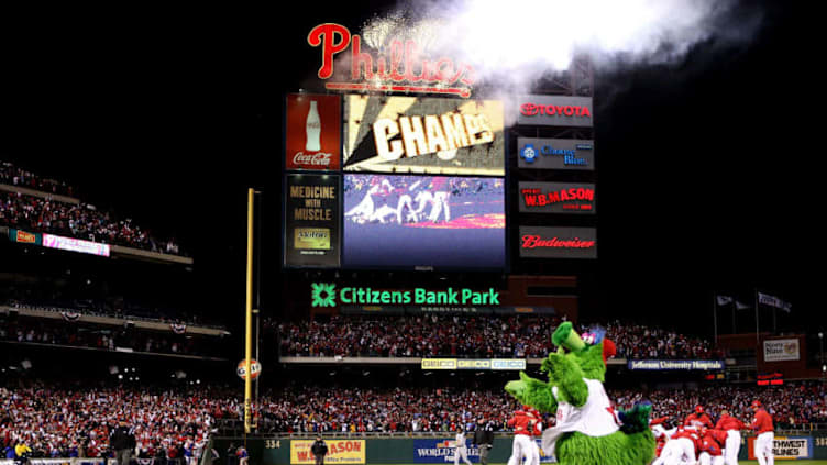 PHILADELPHIA - OCTOBER 29: The Philly Phanatic runs on the field as the Philadelphia Phillies pile up on top of closing pitcher Brad Lidge after they won 4-3 wo win the World Series against the Tampa Bay Rays during the continuation of game five of the 2008 MLB World Series on October 29, 2008 at Citizens Bank Park in Philadelphia, Pennsylvania. (Photo by Jed Jacobsohn/Getty Images)