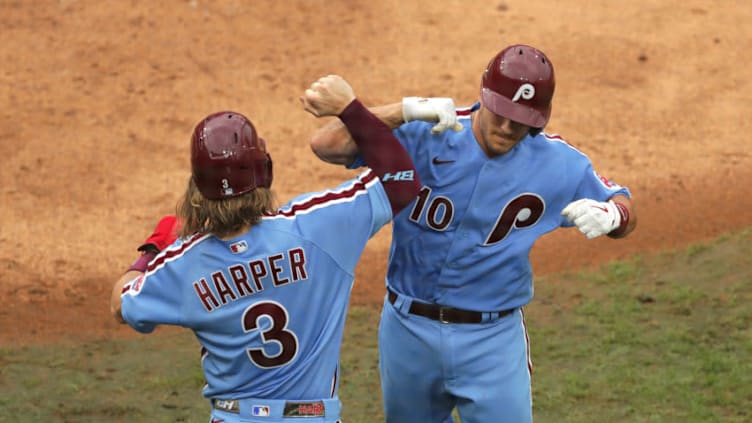 Bryce Harper #3 and J.T. Realmuto #10 of the Philadelphia Phillies (Photo by Hunter Martin/Getty Images)