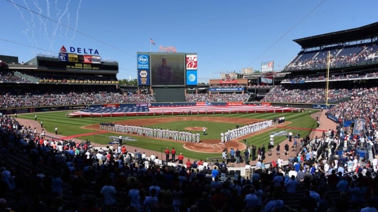 Apr 4, 2016; Atlanta, GA, USA; The teams lineup and the flag is pulled across the outfield prior to the game between the Washington Nationals and the Atlanta Braves at Turner Field. Mandatory Credit: Dale Zanine-USA TODAY Sports