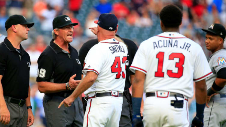 ATLANTA, GA - AUGUST 15: Manager Brian Snitker #43 of the Atlanta Braves argues with the umpires after Ronald Acuna Jr. #13was hit by a pitch during the first inning against the Miami Marlins at SunTrust Park on August 15, 2018 in Atlanta, Georgia. (Photo by Daniel Shirey/Getty Images)