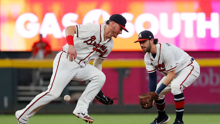 ATLANTA, GEORGIA - SEPTEMBER 17: Josh Donaldson #20 of the Atlanta Braves fails to come up with this single hit by Bryce Harper #3 of the Philadelphia Phillies in the fourth inning at SunTrust Park on September 17, 2019 in Atlanta, Georgia. (Photo by Kevin C. Cox/Getty Images)