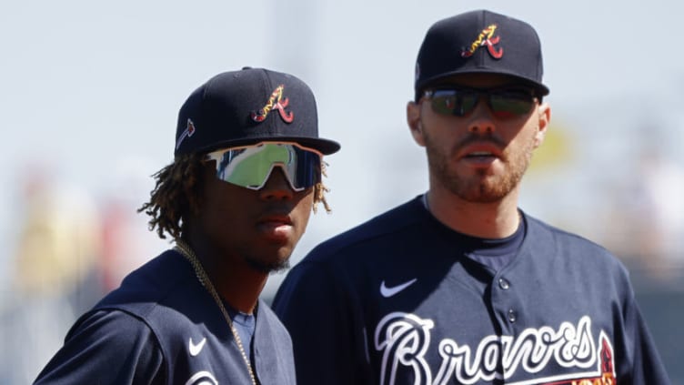 NORTH PORT, FL - FEBRUARY 22: Ronald Acuna Jr. #13 and Freddie Freeman #5 of the Atlanta Braves look on during a Grapefruit League spring training game against the Baltimore Orioles at CoolToday Park on February 22, 2020 in North Port, Florida. The Braves defeated the Orioles 5-0. (Photo by Joe Robbins/Getty Images)